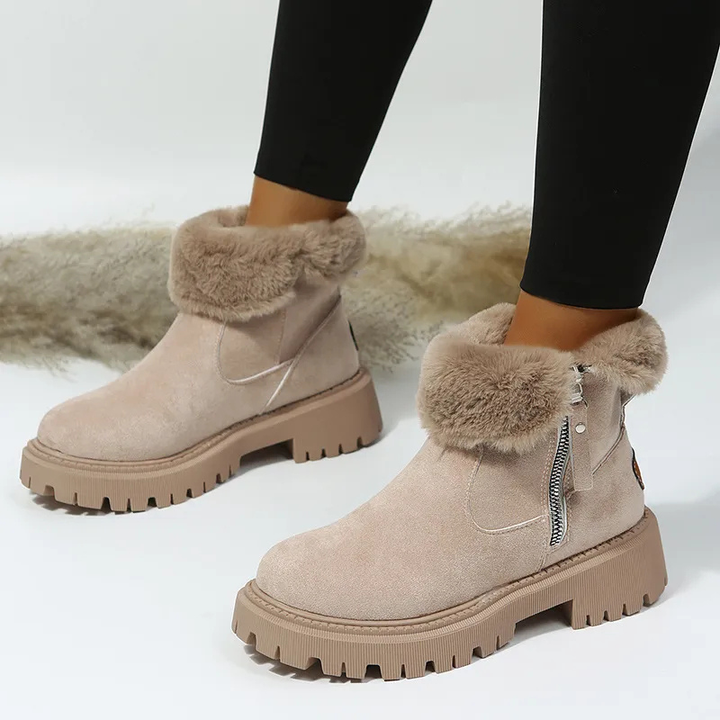 Women's ankle boots with plush fur cuffs, side zippers and lug soles