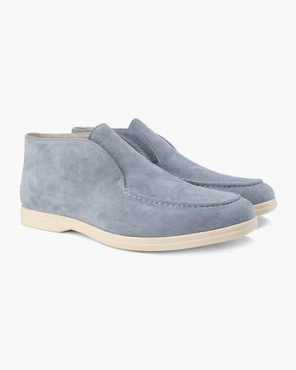 Ankle-height slip-on loafers with rounded toes, stitched apron detailing and flat contrasting soles