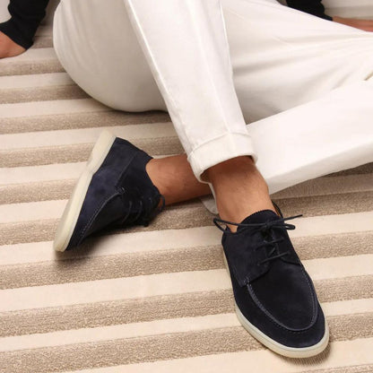 Men's lace-up moc toe loafers shown in navy blue and beige with light soles