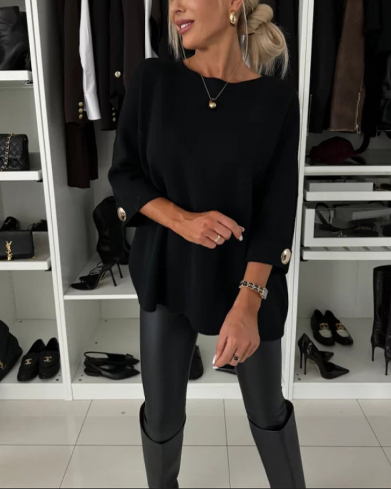 Women's solid round neck sweater with long sleeves and button cuff details