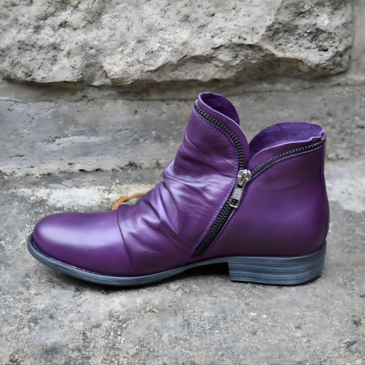 Ankle boots with diagonal zipper, rounded toe and low heel