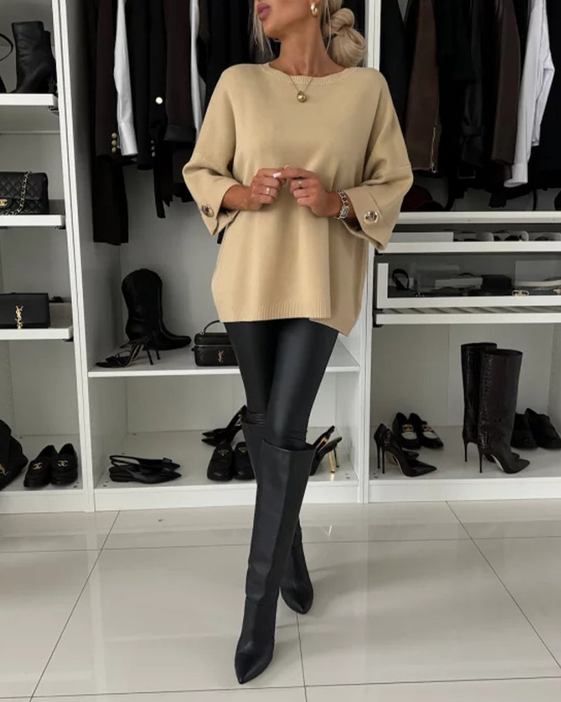 Women's solid round neck sweater with long sleeves and button cuff details