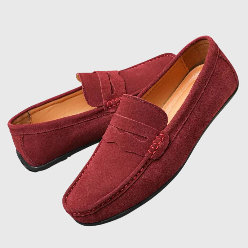 Classic slip-on loafers with penny strap and moc-toe stitching