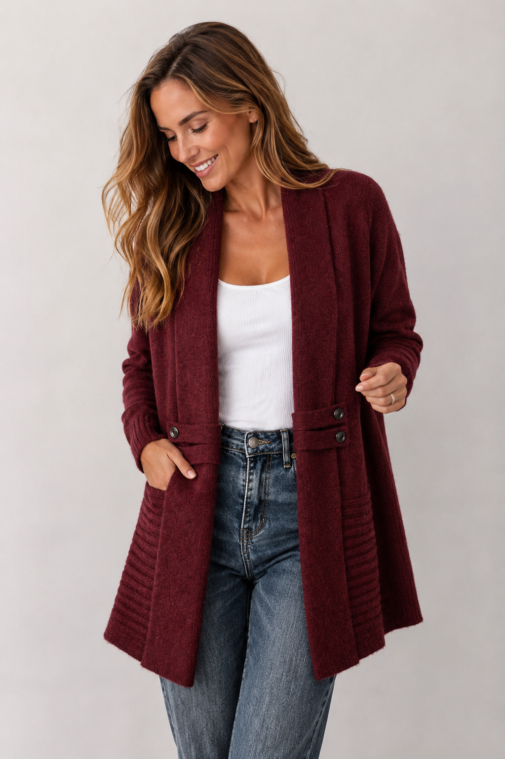 Women's long textured cardigan with open front, long sleeves and buttoned pocket tabs
