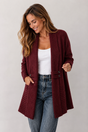 Women's long textured cardigan with open front, long sleeves and buttoned pocket tabs