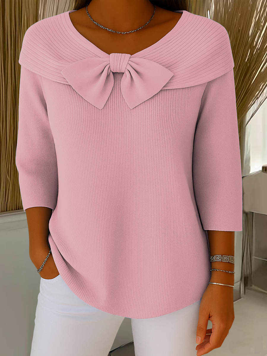 Women's ribbed sweater top with boat neckline and front bow