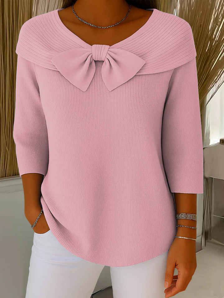 Women's ribbed sweater top with boat neckline and front bow