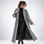 Women's long geometric patterned coat with notched lapels and button fastening