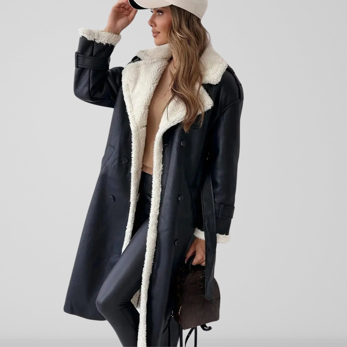 Women's long coat with contrasting shearling-style trim, lapel collar and double-breasted buttons