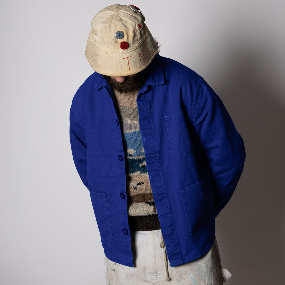Men's blue button-front work jacket with collar and patch pockets