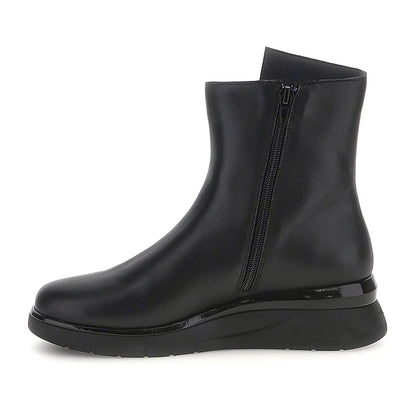 Black ankle boots with twin side zippers and platform soles