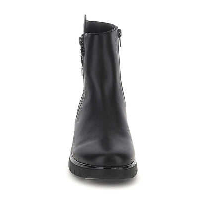 Black ankle boots with twin side zippers and platform soles