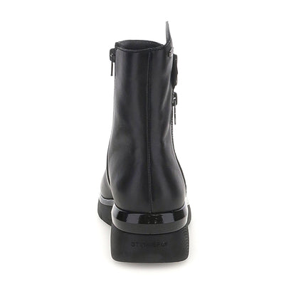 Black ankle boots with twin side zippers and platform soles