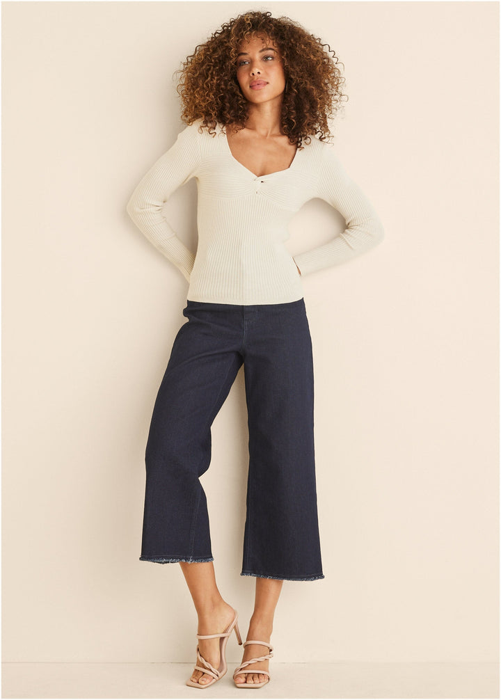 Women's cream ribbed sweater with twist front and long sleeves