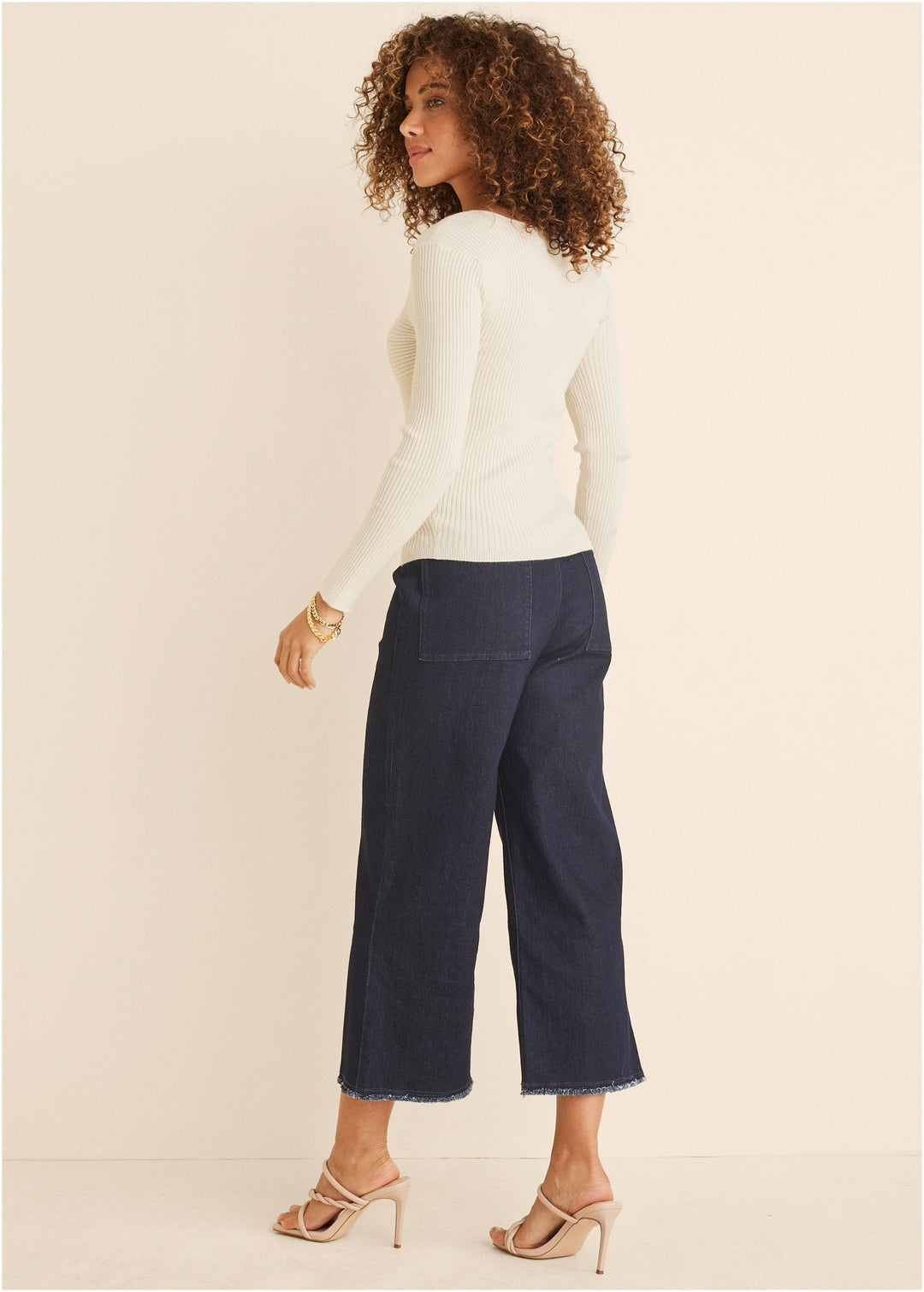 Women's cream ribbed sweater with twist front and long sleeves