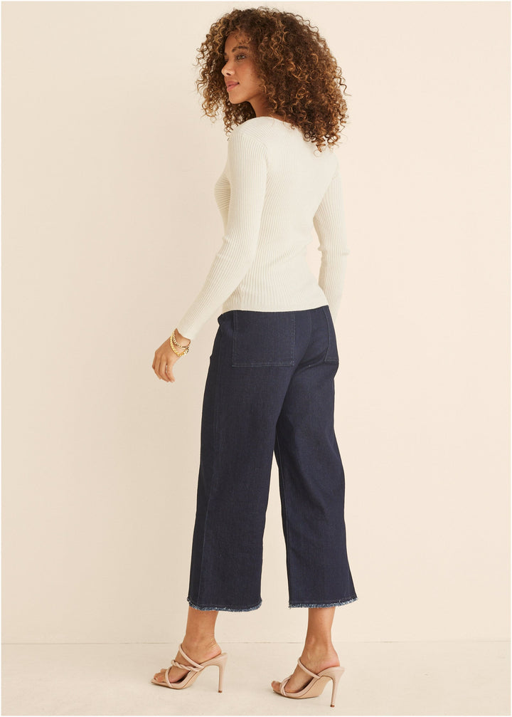 Women's cream ribbed sweater with twist front and long sleeves