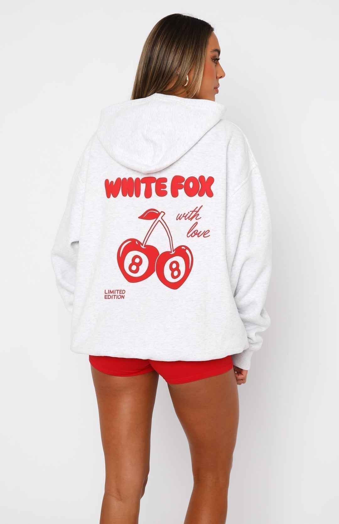 Women's white oversized hoodie with red lettering and cherry graphic