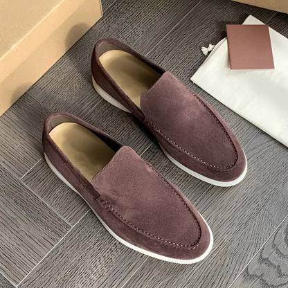 Men's slip-on loafers with stitched apron toes and flat soles