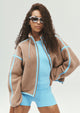 Women's brown sherpa jacket with blue contrast trim and hood