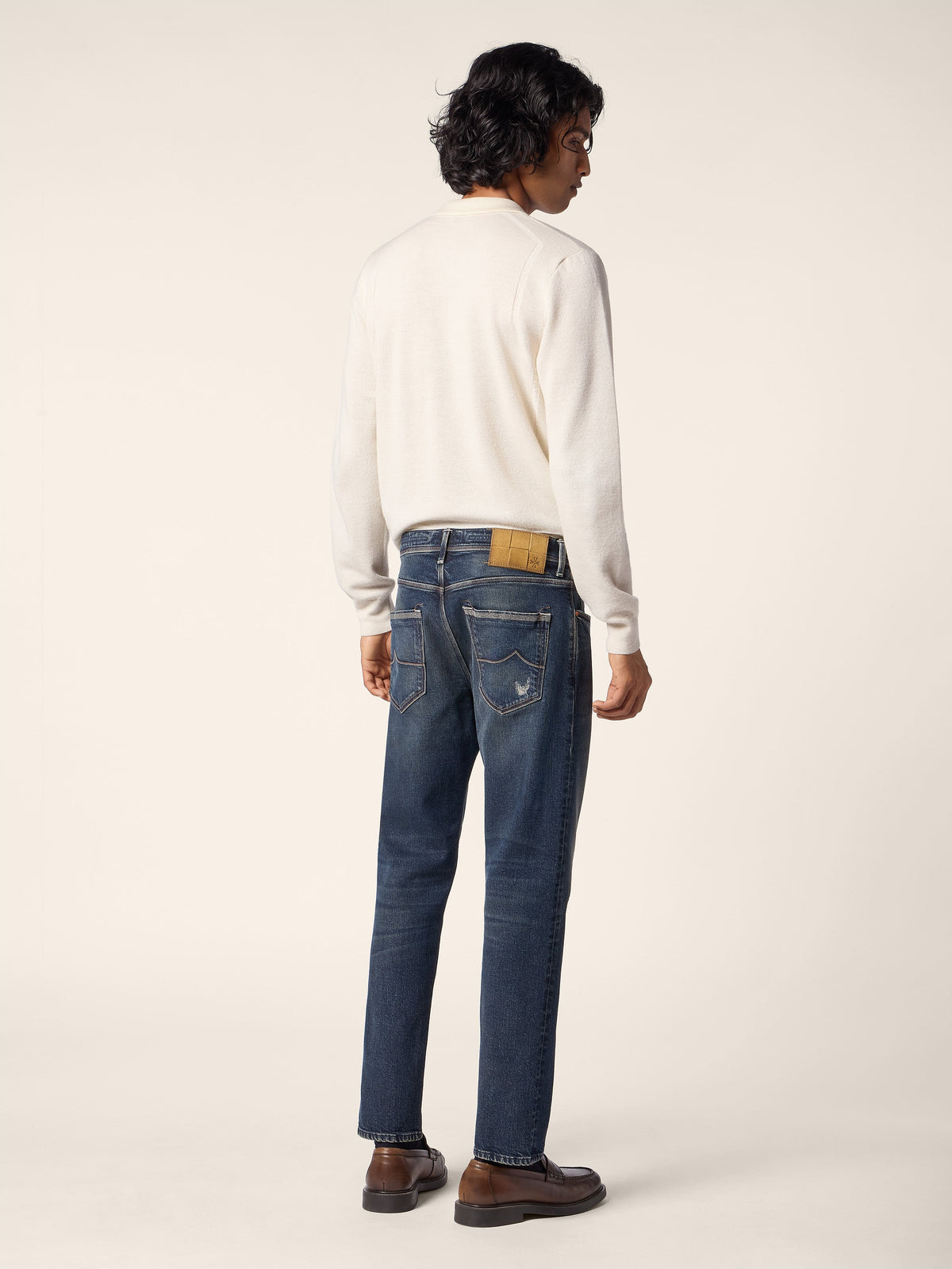 Men's cream long-sleeve polo sweater with folded collar and ribbed cuffs