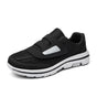 Women's wide toe slip-on sneakers with hook-and-loop straps and layered soles