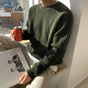 Unisex ribbed crew neck sweater in green and white, long sleeves, relaxed fit