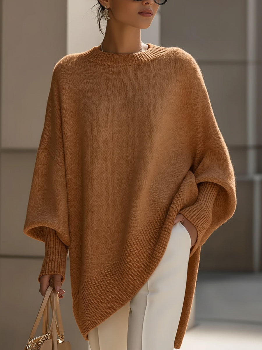 Women's oversized knit sweater with crew neck and asymmetric longline hem