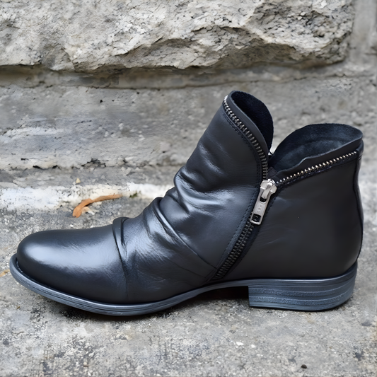 Ankle boots with diagonal zipper, rounded toe and low heel