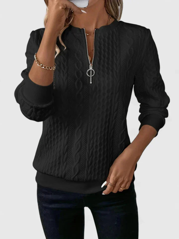 Women's textured cable knit sweater with zip neckline and ribbed trims
