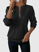 Women's textured cable knit sweater with zip neckline and ribbed trims