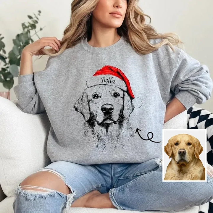 Unisex grey Christmas sweatshirt with dog Santa hat design, shown on family members around decorated kitchen