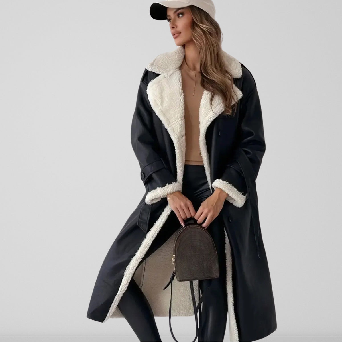 Women's long coat with contrasting shearling-style trim, lapel collar and double-breasted buttons