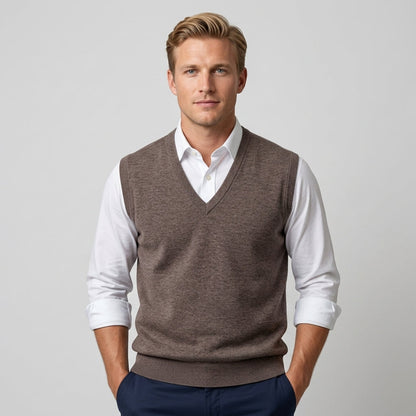 Men's sleeveless V-neck sweater vest layered over a collared shirt