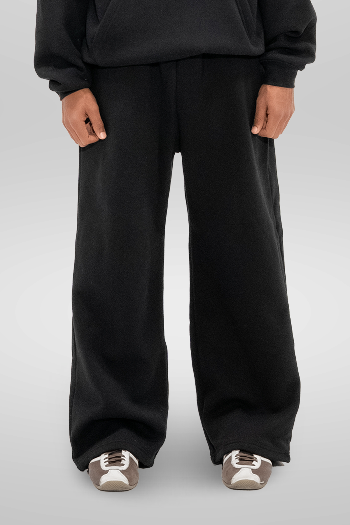 Men's black wide-leg sweatpants with elastic waistband and side pockets