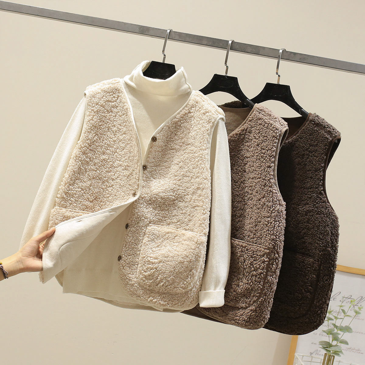 Women's textured sleeveless vest with button front and large patch pockets