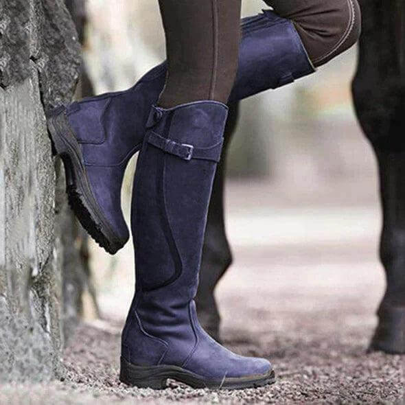 Women's tall riding boots with buckle straps, rounded toes and low heels