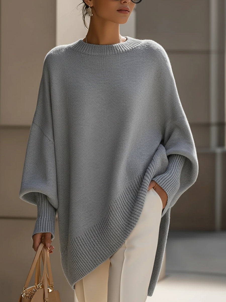 Women's oversized knit sweater with crew neck and asymmetric longline hem