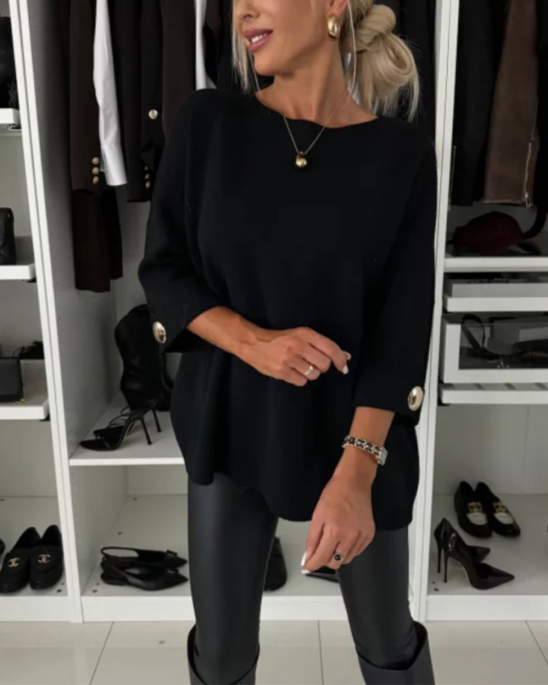 Women's solid round neck sweater with long sleeves and button cuff details