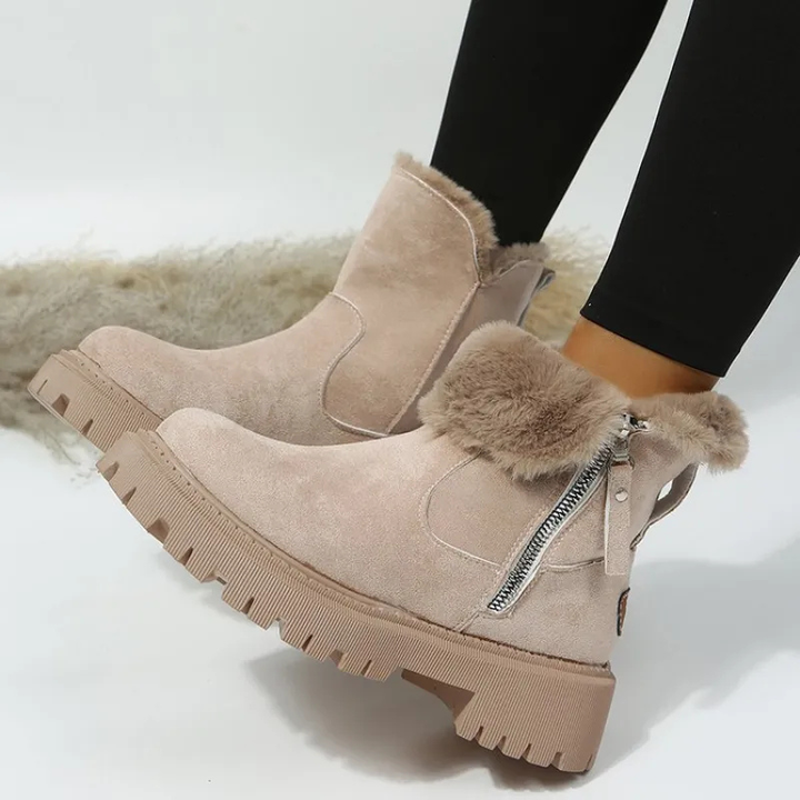 Women's ankle boots with plush fur cuffs, side zippers and lug soles