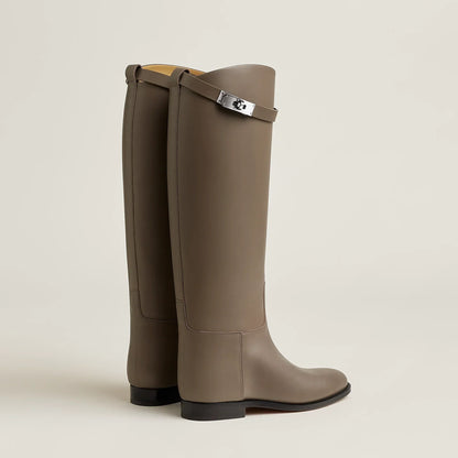 Women's tall riding boots with round toes, low heels and upper strap detail