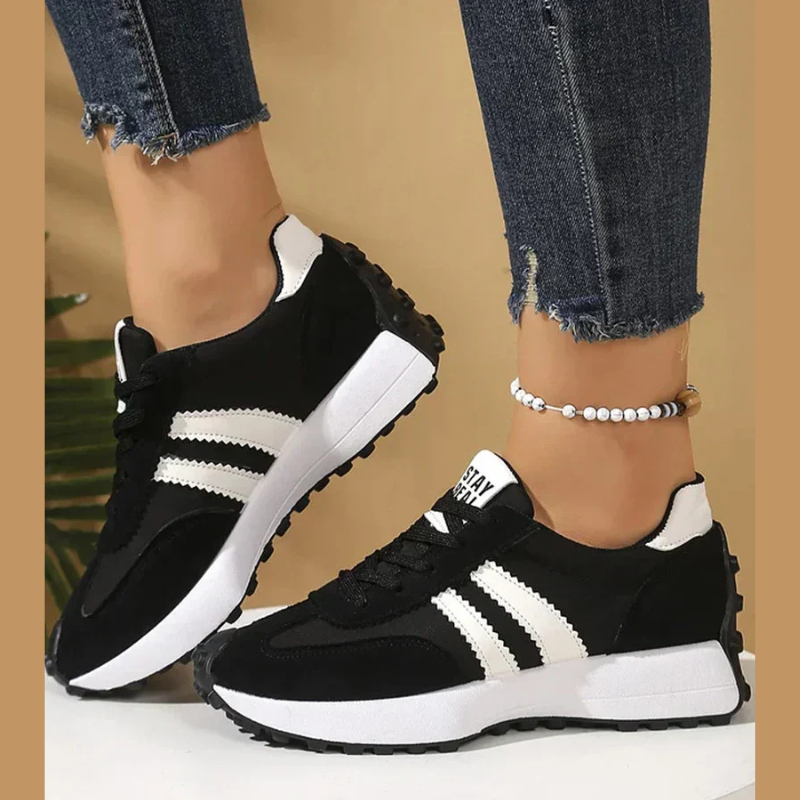 Women's retro lace-up sneakers with striped side panels and flat textured soles