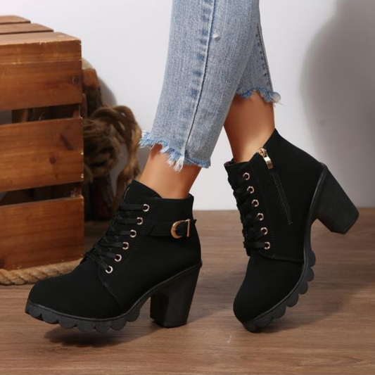 Women's black lace-up ankle boots with metal buckle detail and chunky sole