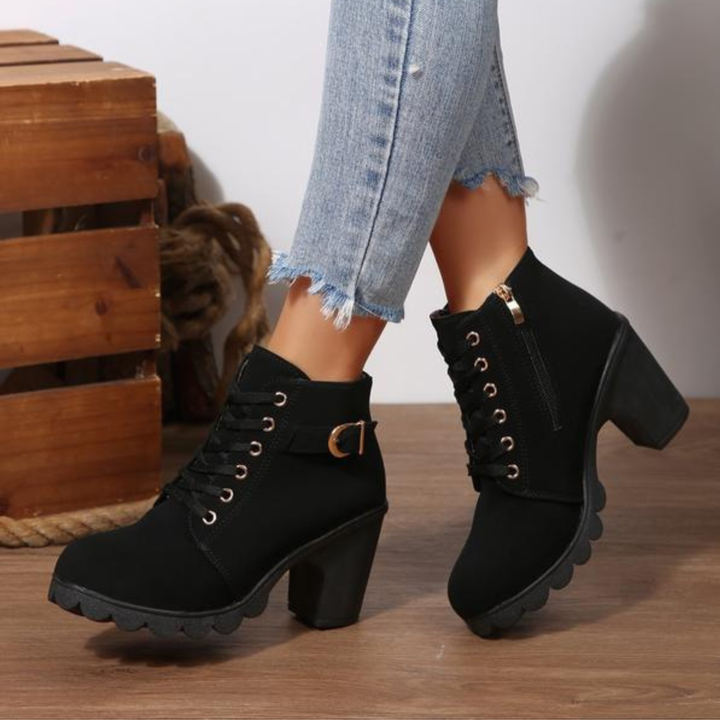 Women's black lace-up ankle boots with metal buckle detail and chunky sole