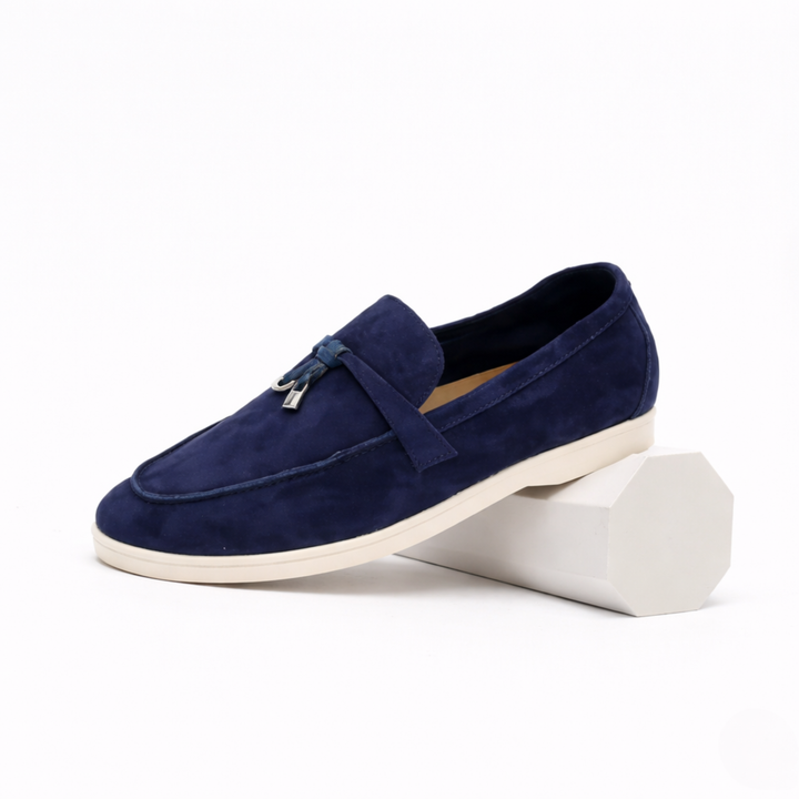 Women's slip-on loafers with flat soles, stitched toes and metal vamp trim