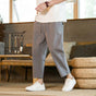 Men's relaxed tapered ankle trousers with drawstring waist and side pockets