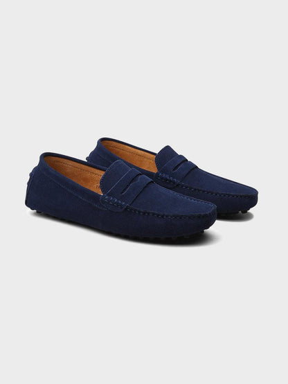 Suede boat loafers with moc stitching and penny-style straps