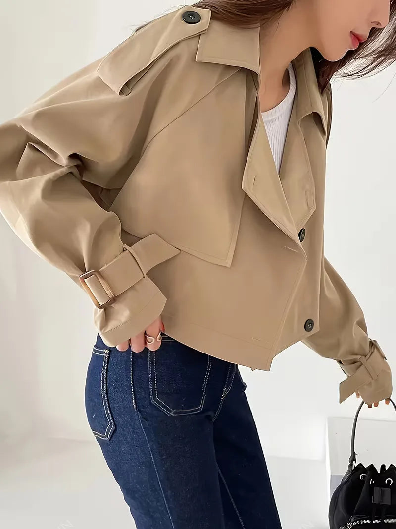 Women's beige cropped double-breasted trench coat with buckle cuffs