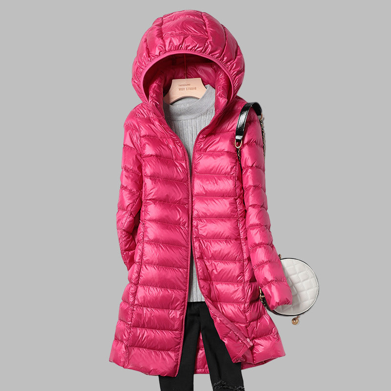Women's hooded longline puffer coat with quilted panels and zip front