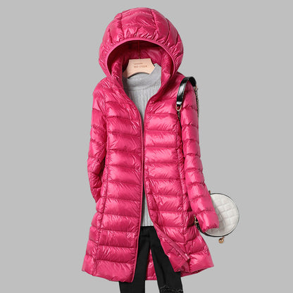 Women's hooded longline puffer coat with quilted panels and zip front