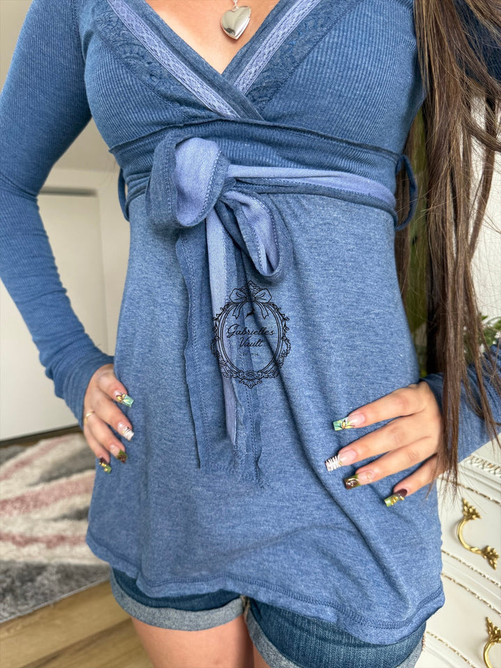 Women's long-sleeve wrap babydoll top with V-neck and waist tie